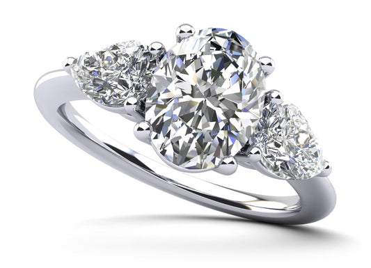 Elegant Three Stone Oval And Pear Diamond Engagement Ring