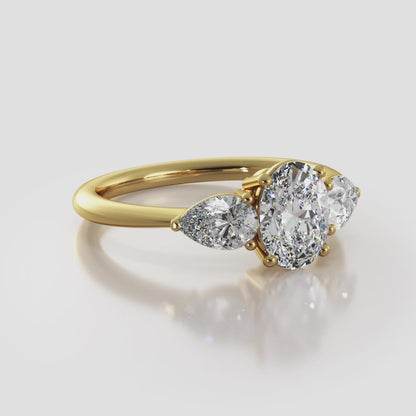 Elegant Three Stone Oval And Pear Diamond Engagement Ring