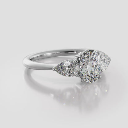 Elegant Three Stone Oval And Pear Diamond Engagement Ring